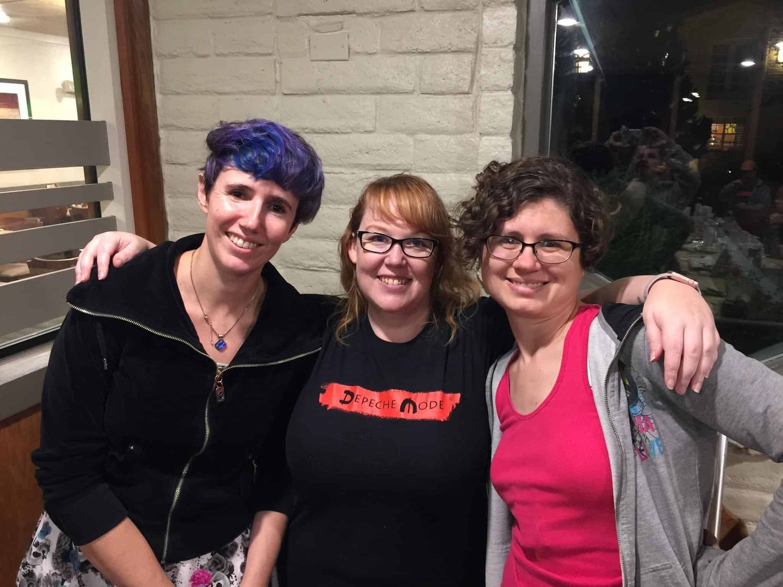 Creative Writing Workshop Participants at DenNoWriMo Event Group of diverse women smiling at DenNoWriMo creative writing event.