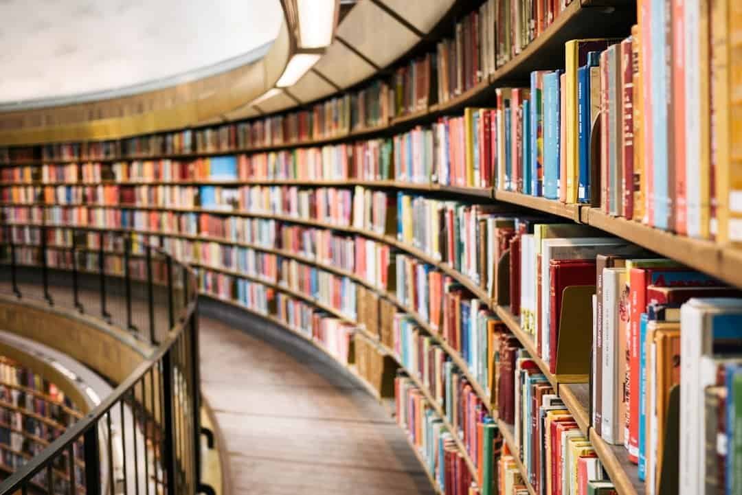 Bookshelf with a wide selection of books in a contemporary library setting.